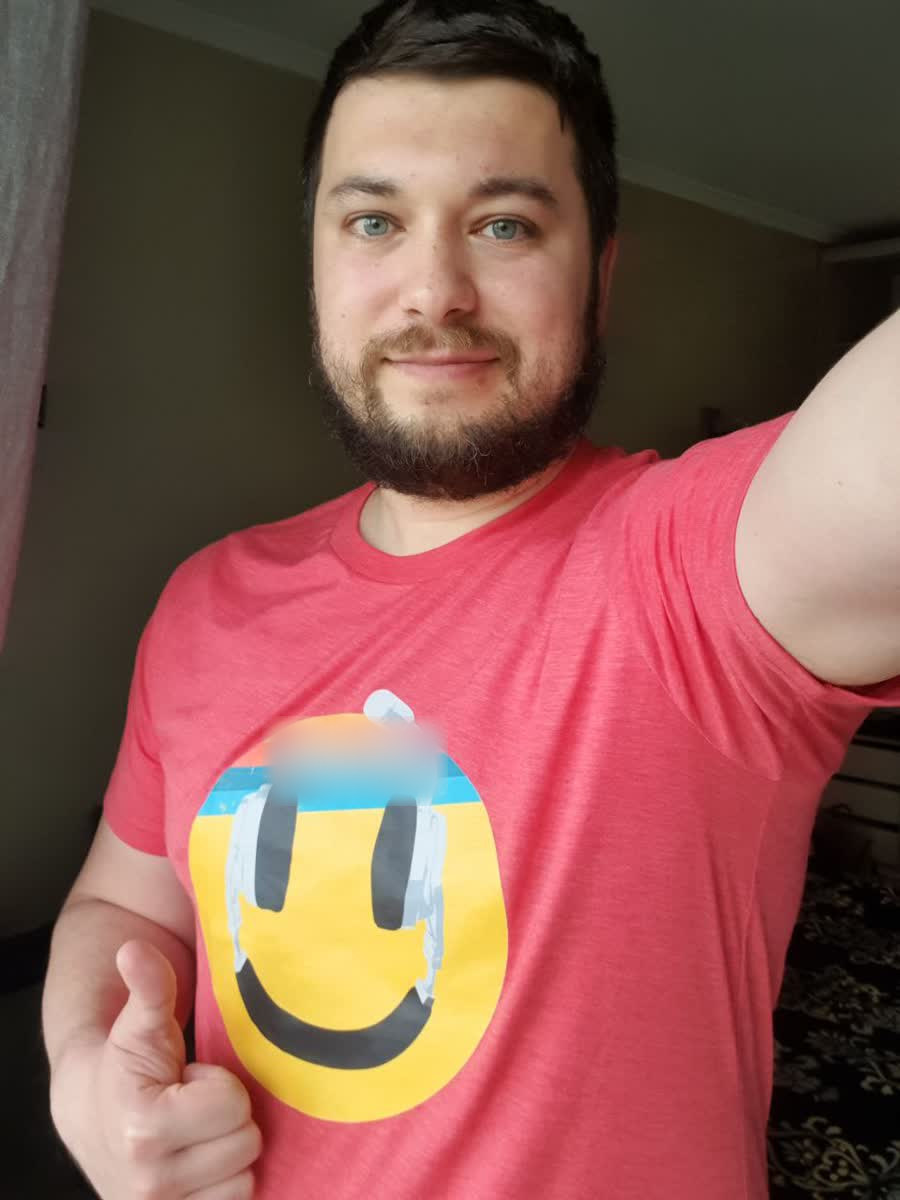 Fluvius team member wearing a client’s branded shirt — a long-running commerce client relationship