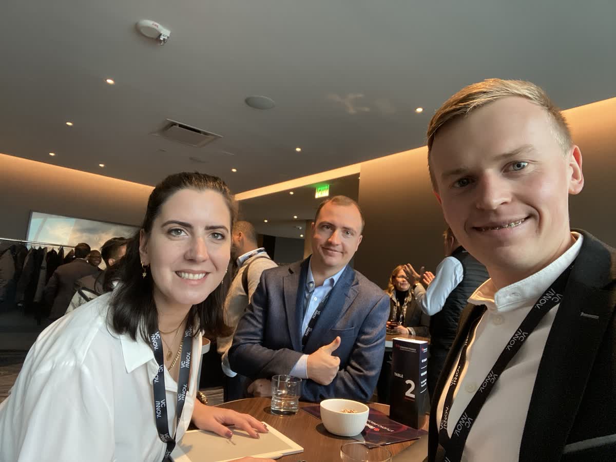 Engineers comparing notes on AI-generated codebases at an industry event