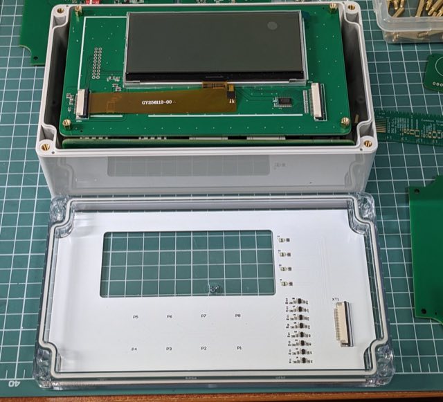 Enclosure with a machined display window and its board on the bench