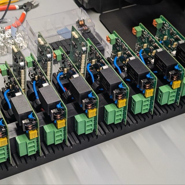 A run of assembled modules in a carrier, ready for test