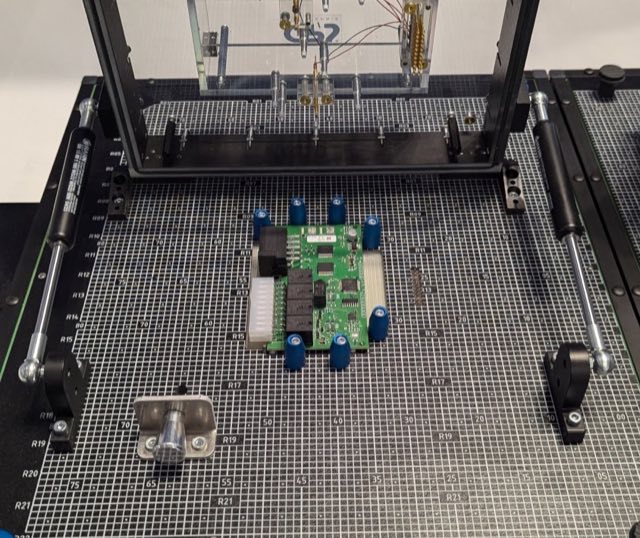 Functional test fixture exercising an assembled device at the hardware lab